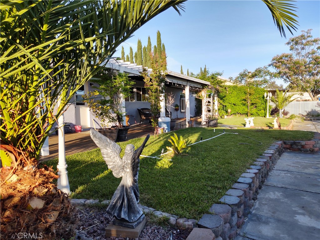 15274 Rodeo Street Hesperia, CA 92345 - Photo 12 of 43 a view of a park with plants and a bench