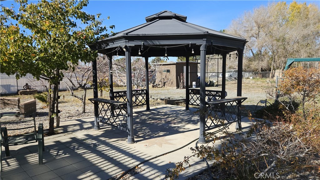15274 Rodeo Street Hesperia, CA 92345 - Photo 14 of 43 a view of a chairs and table in the patio