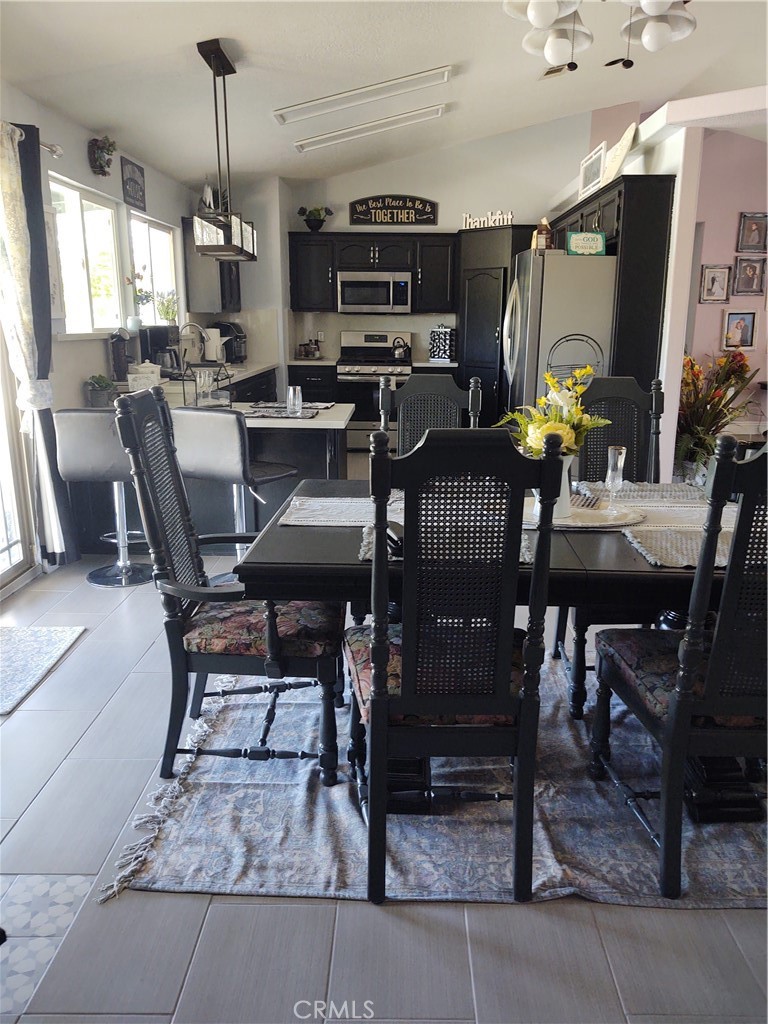15274 Rodeo Street Hesperia, CA 92345 - Photo 17 of 43 a view of a dining room with furniture