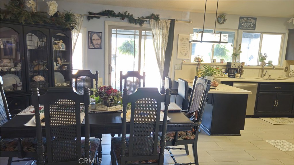 15274 Rodeo Street Hesperia, CA 92345 - Photo 20 of 43 a view of a dining room with furniture window and outside view