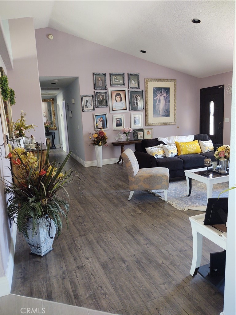 15274 Rodeo Street Hesperia, CA 92345 - Photo 21 of 43 a living room with furniture and wooden floor