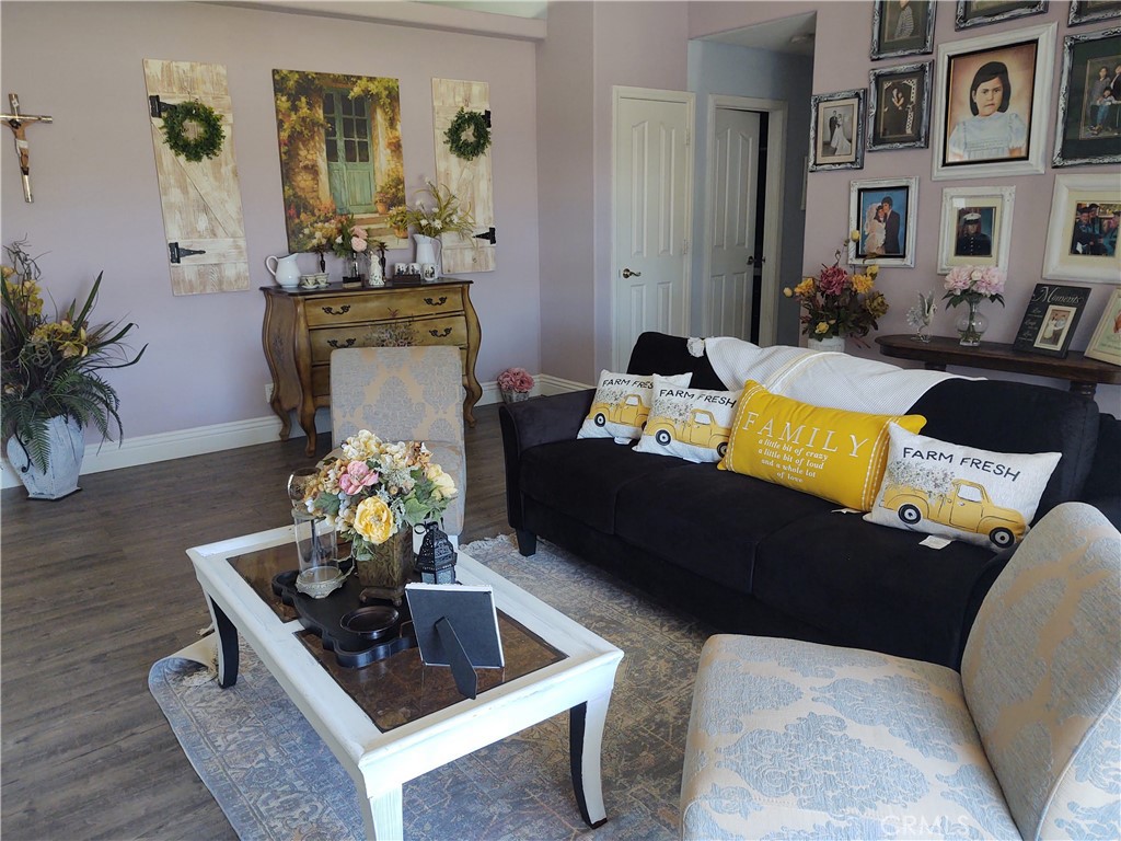 15274 Rodeo Street Hesperia, CA 92345 - Photo 22 of 43 a living room with furniture and wooden floor