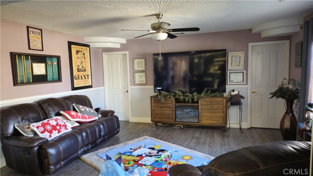 15274 Rodeo Street Hesperia, CA 92345 - Photo 27 of 43 a living room with furniture and a window