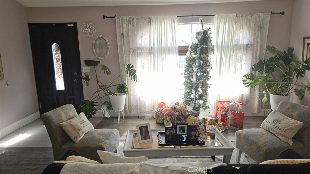 15274 Rodeo Street Hesperia, CA 92345 - Photo 28 of 43 a living room with furniture and a potted plant