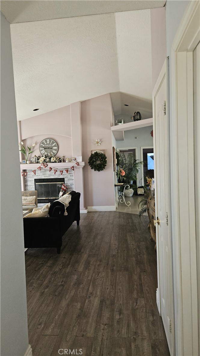 15274 Rodeo Street Hesperia, CA 92345 - Photo 31 of 43 a living room with furniture and a chandelier