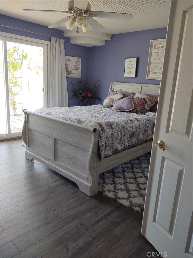 15274 Rodeo Street Hesperia, CA 92345 - Photo 32 of 43 a bedroom with a bed and a window