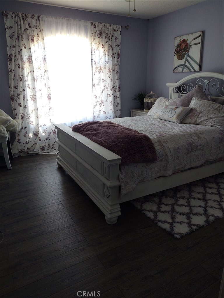 15274 Rodeo Street Hesperia, CA 92345 - Photo 35 of 43 a bedroom with a bed and a window