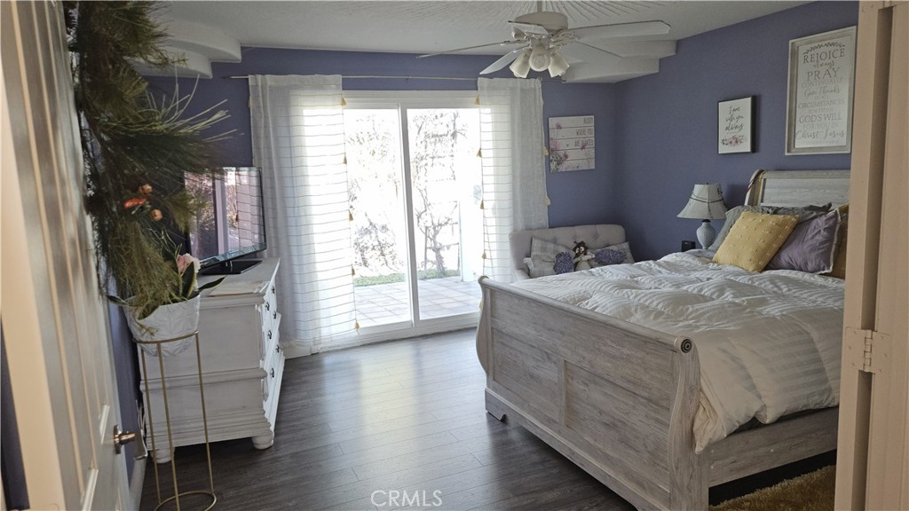 15274 Rodeo Street Hesperia, CA 92345 - Photo 38 of 43 a living room with furniture and a flat screen tv