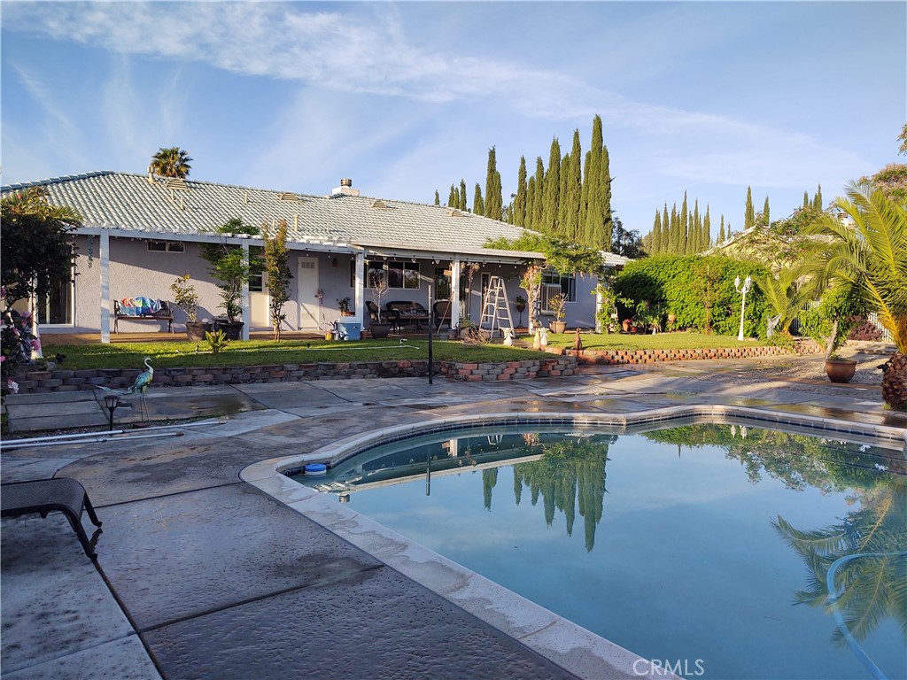 15274 Rodeo Street Hesperia, CA 92345 - Photo 5 of 43 a view of a swimming pool with a patio