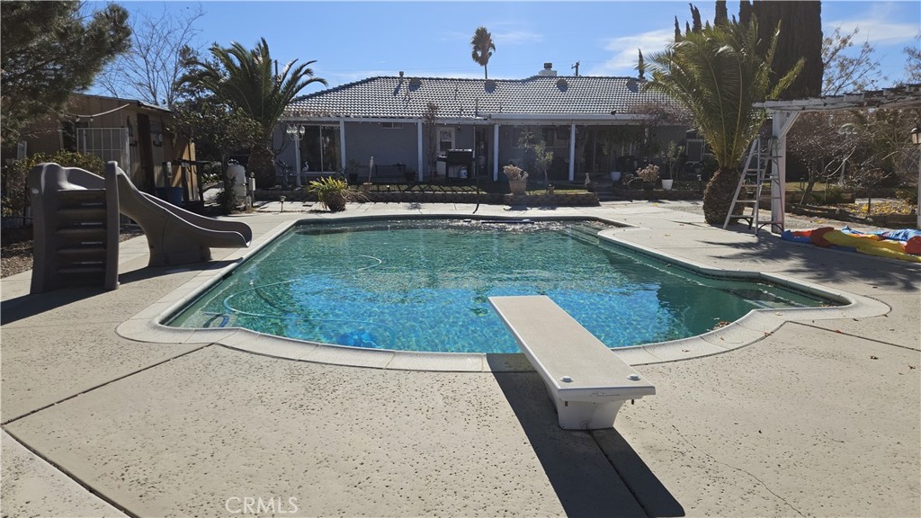 15274 Rodeo Street Hesperia, CA 92345 - Photo 9 of 43 a view of a patio with swimming pool