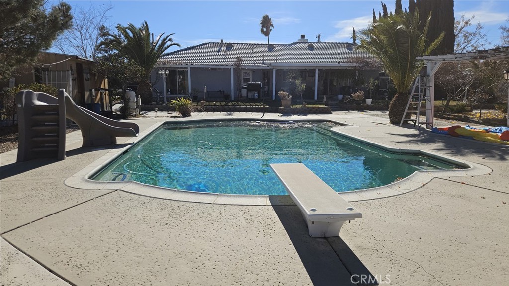 15274 Rodeo Street Hesperia, CA 92345 - Photo 10 of 43 a view of a patio with swimming pool
