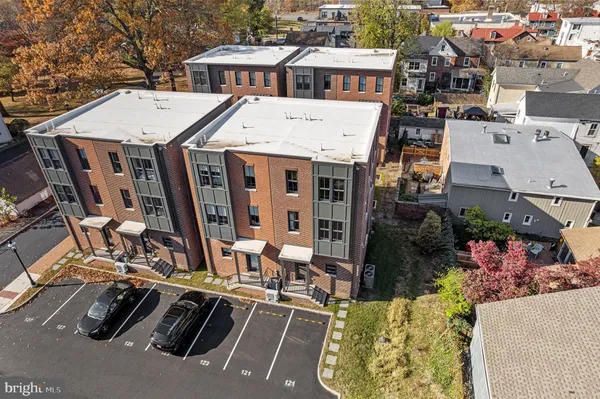 an aerial view of residential houses with outdoor space
