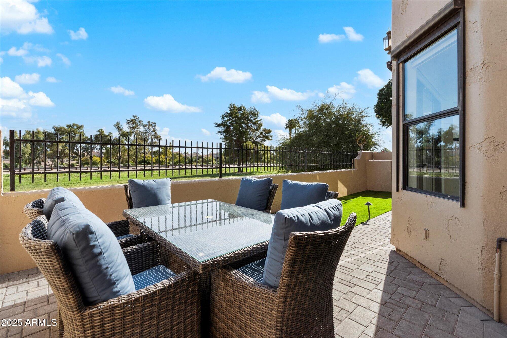 7955 East Chaparral Road, Unit 17 Scottsdale, AZ 85250 - Photo 45 of 57 paver Covered Patio and Turf Area