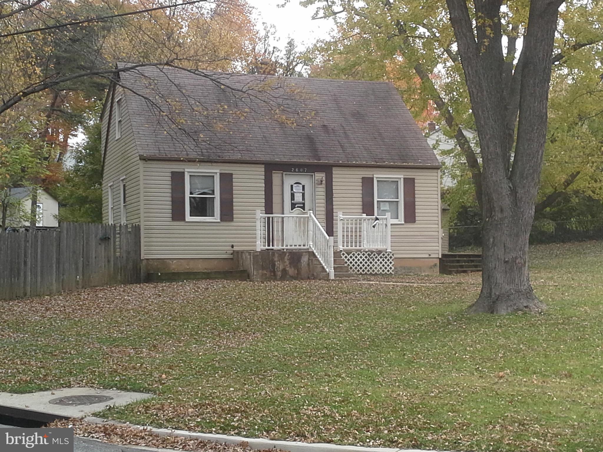 2607 Lindell Street Silver Spring, MD 20902 - Photo 1 of 4 a house that has a tree in front of it