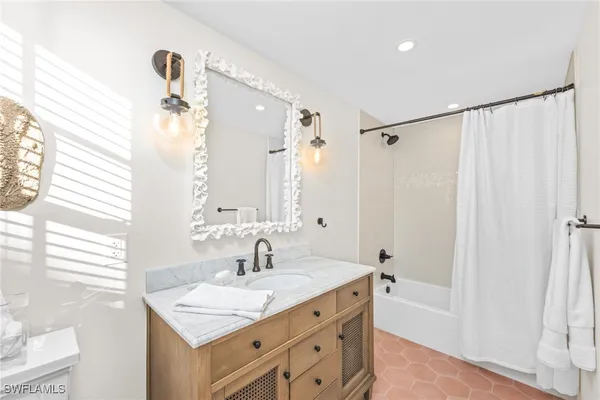 a bathroom with a sink double vanity and a mirror