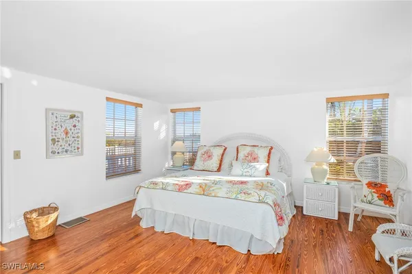 a bed room with a bed and a window