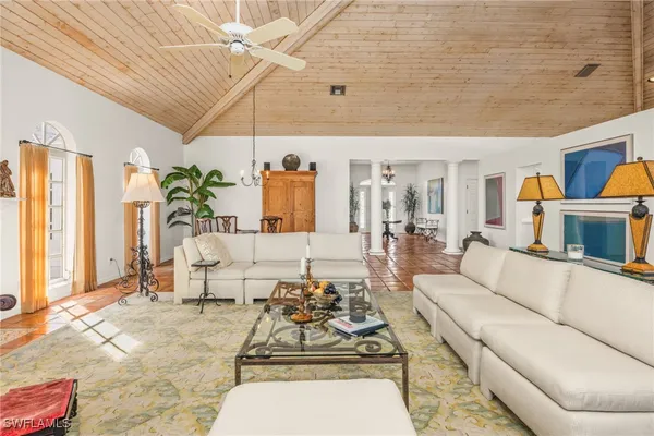 a living room with furniture and a table