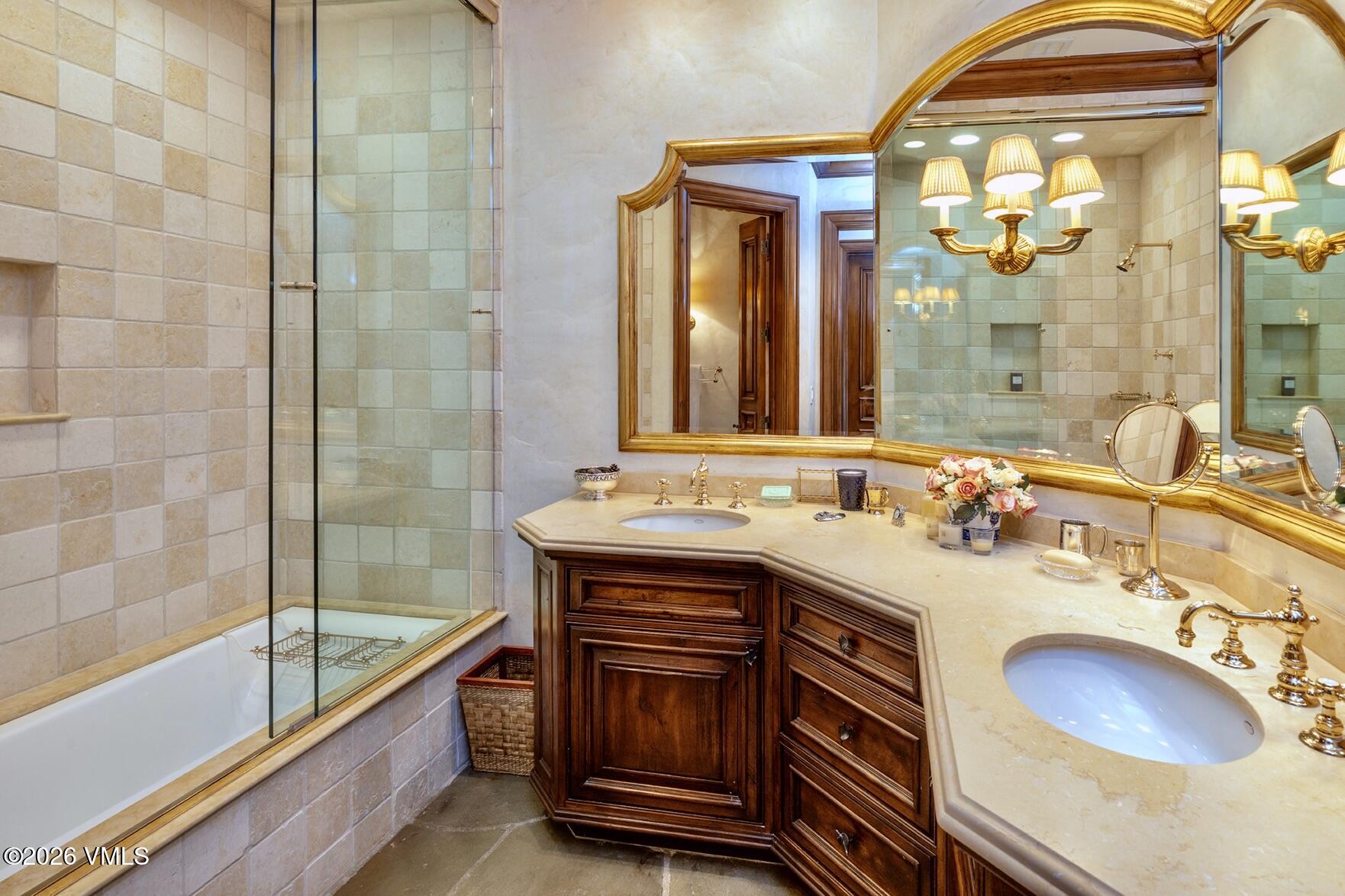 677 Pilgrim Drive Edwards, CO 81632 - Photo 37 of 64 a bathroom with a sink double vanity and a bathtub