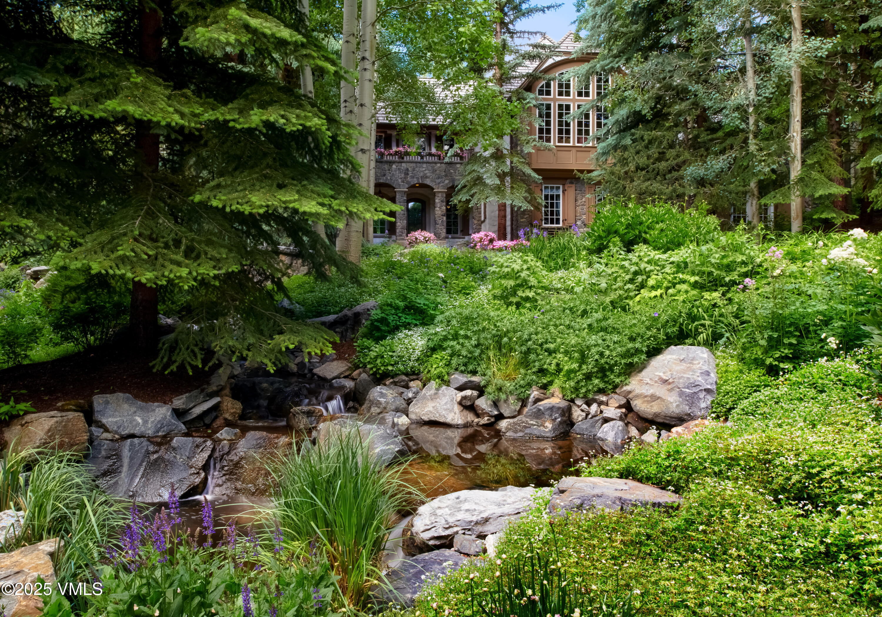 677 Pilgrim Drive Edwards, CO 81632 - Photo 49 of 64 a view of a house with a yard and garden