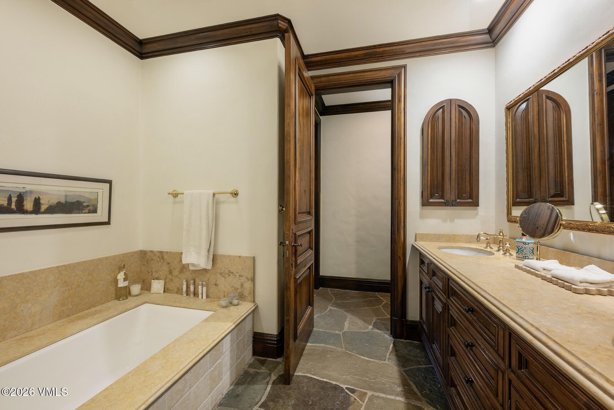 677 Pilgrim Drive Edwards, CO 81632 - Photo 56 of 64 a spacious bathroom with a double vanity sink and a mirror