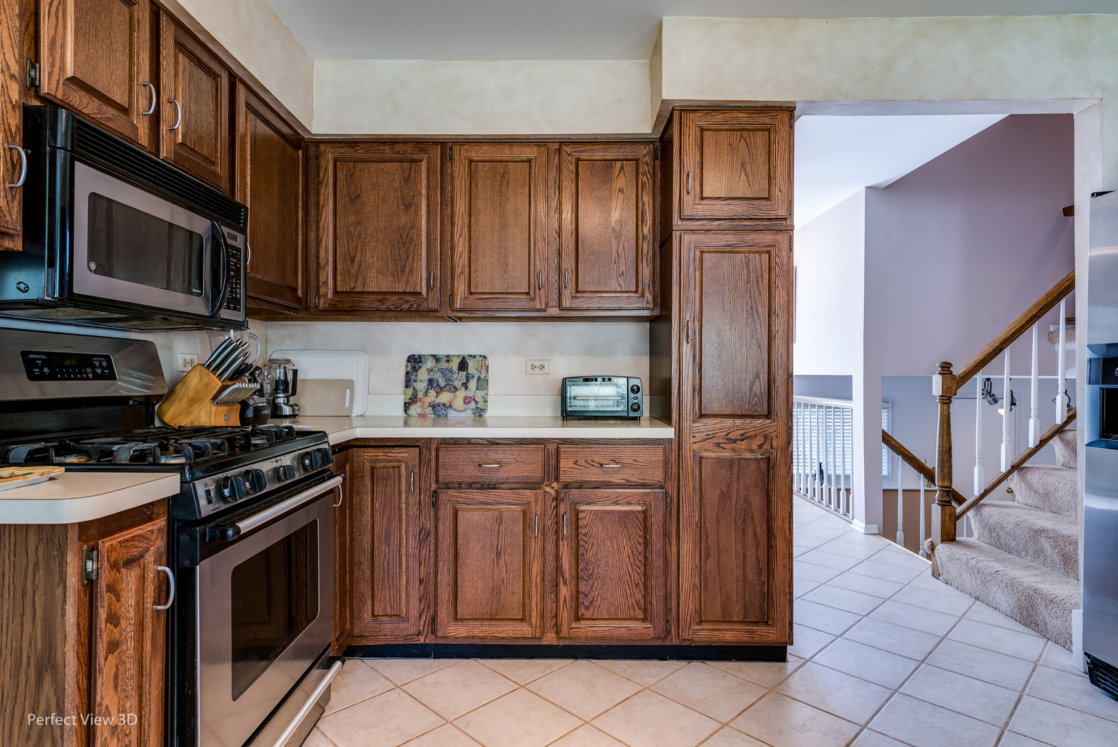 586 Siems Circle Roselle, IL 60172 - Photo 6 of 25 a kitchen with stainless steel appliances granite countertop a stove top oven a sink dishwasher and cabinets with wooden cabinets