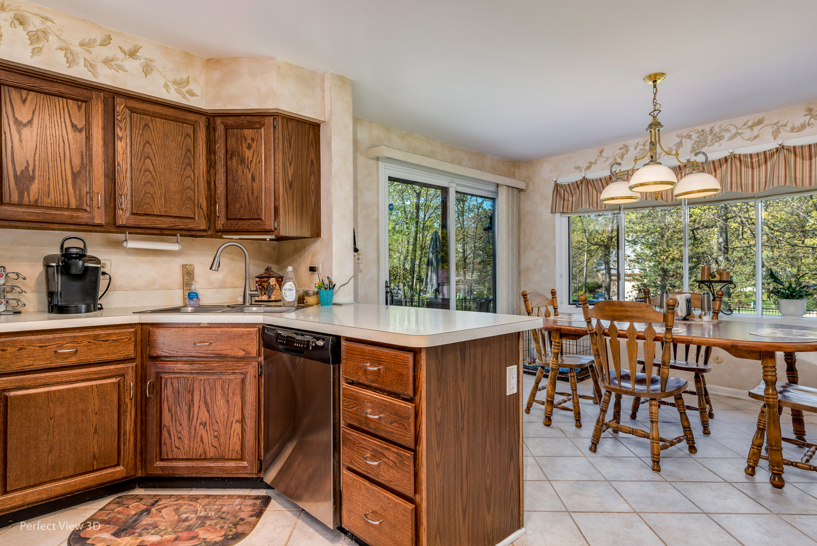 586 Siems Circle Roselle, IL 60172 - Photo 7 of 25 a kitchen with a sink and chairs