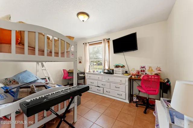 a room with furniture and a flat screen tv