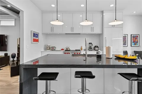 a kitchen with lots of counter space and appliances