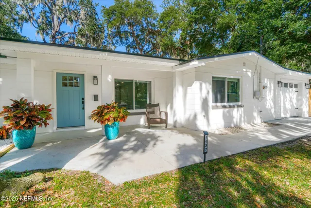 a view of a backyard with a patio