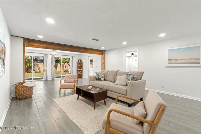 a living room with furniture and a table