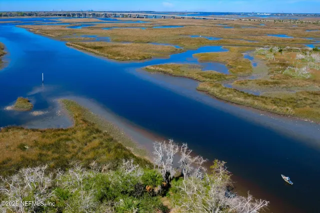 an aerial view of a house with a swimming pool