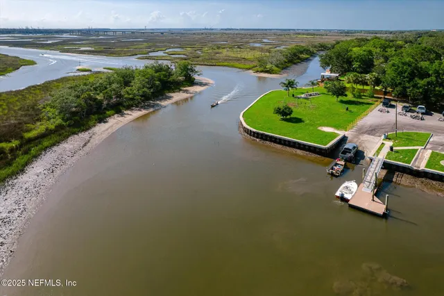 an aerial view of a house with a lake view