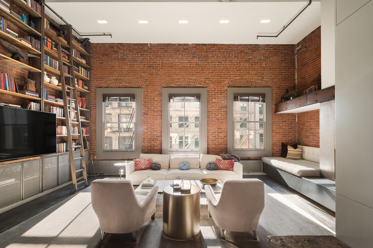 58 Walker Street, Unit PH Manhattan, NY 10013 - Photo 1 of 18 a living room with furniture a flat screen tv and windows