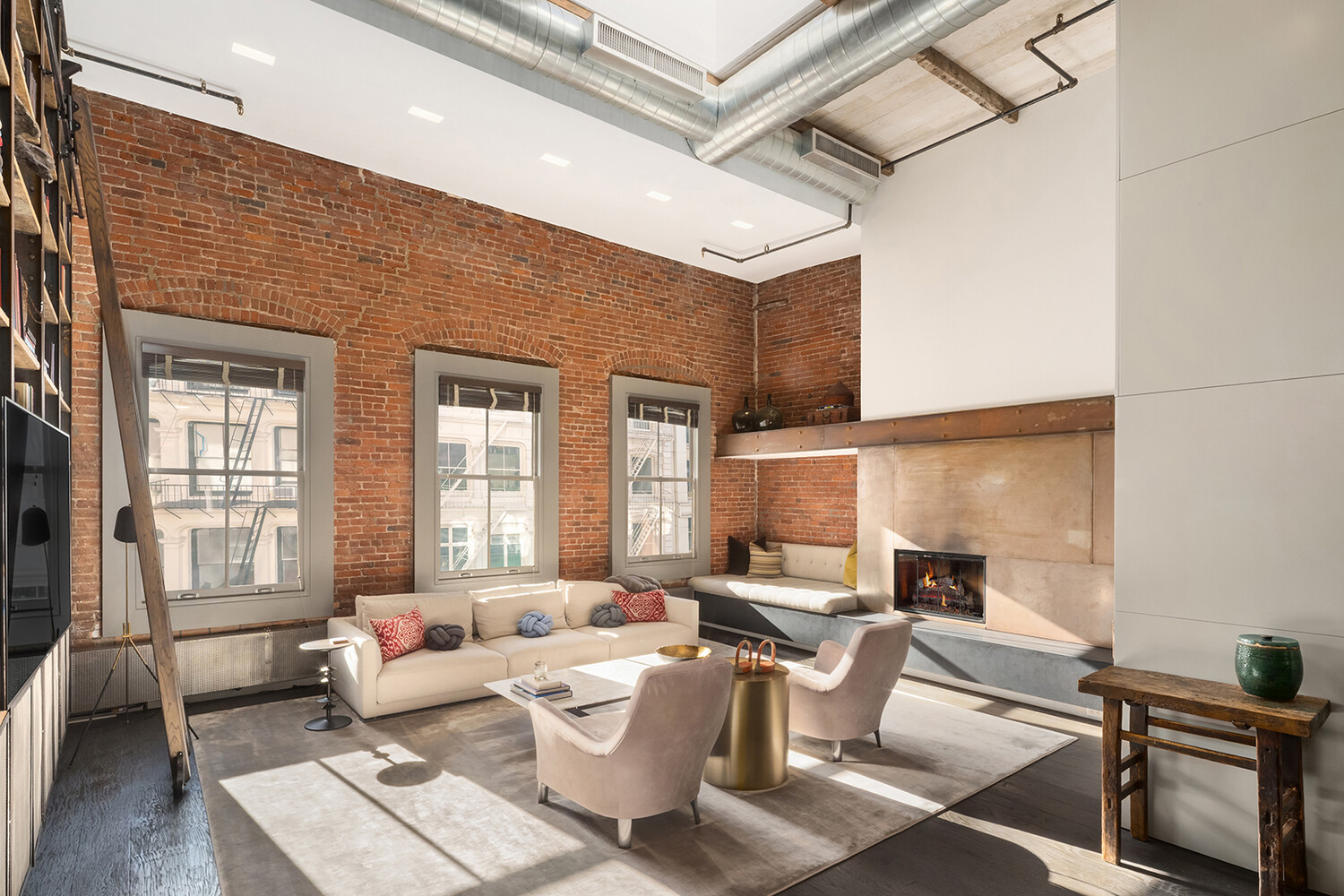 58 Walker Street, Unit PH Manhattan, NY 10013 - Photo 2 of 18 a living room with furniture and a window