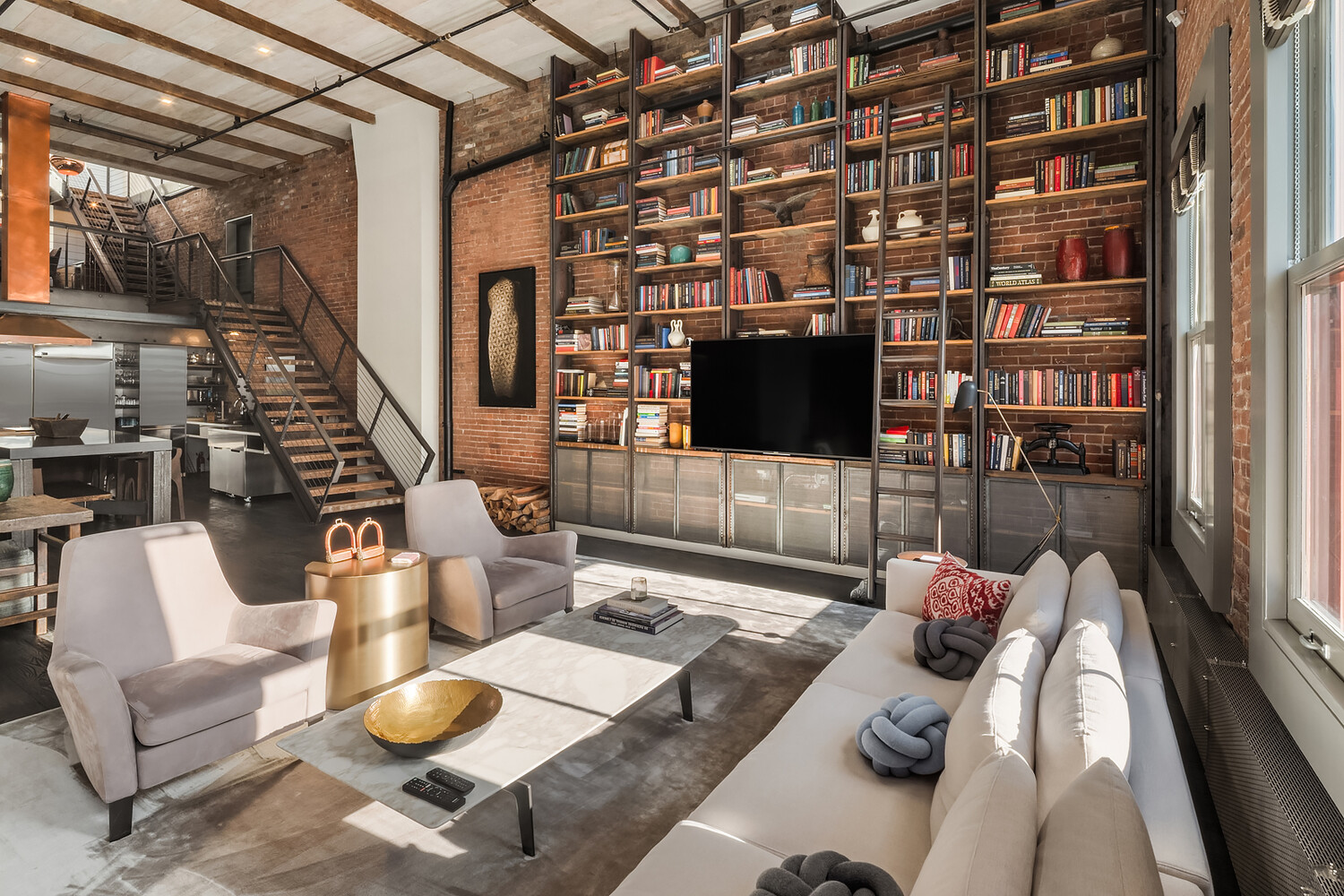 58 Walker Street, Unit PH Manhattan, NY 10013 - Photo 3 of 18 a living room with furniture and a flat screen tv