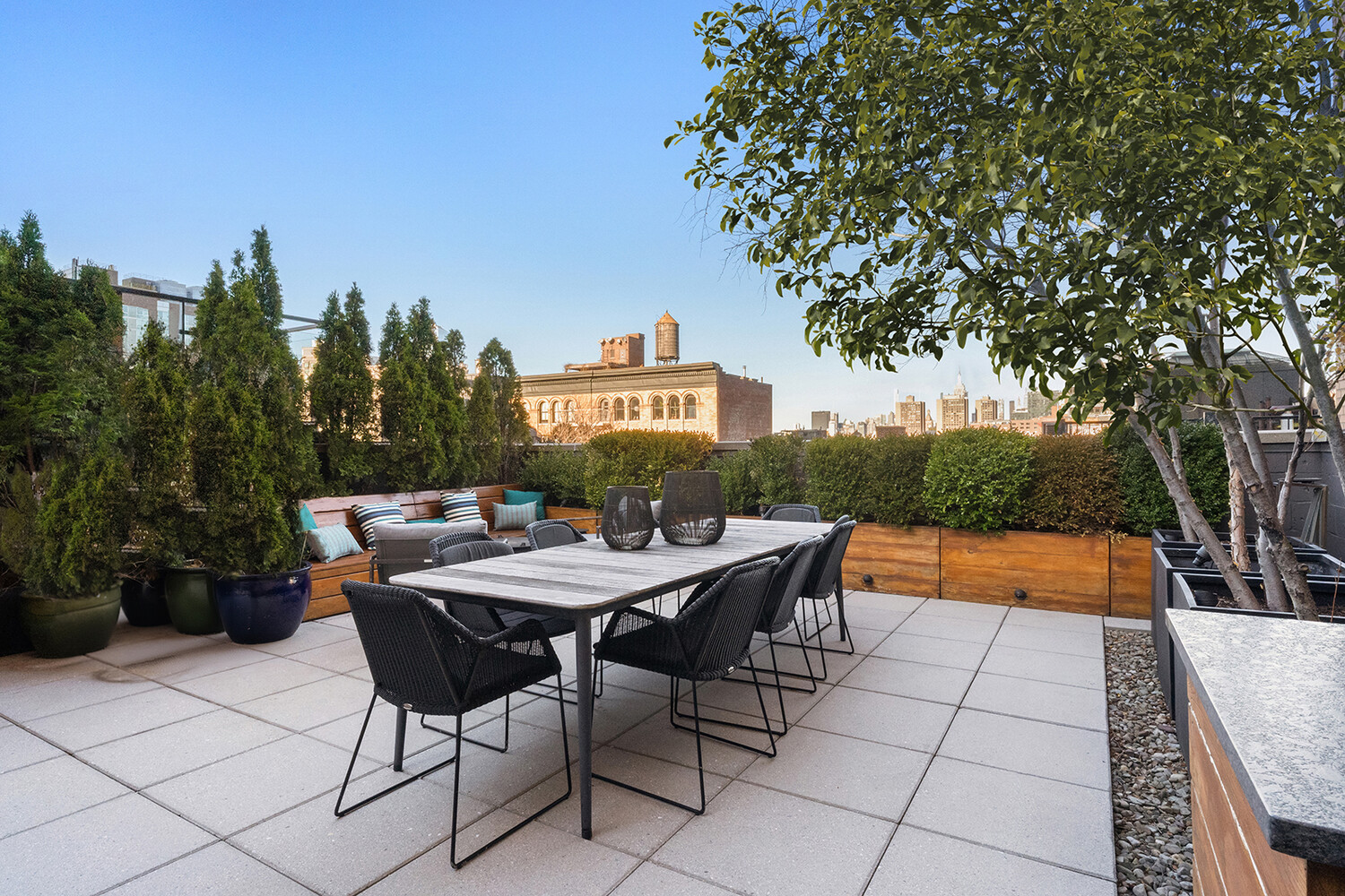 58 Walker Street, Unit PH Manhattan, NY 10013 - Photo 9 of 18 a backyard of a house with table and chairs