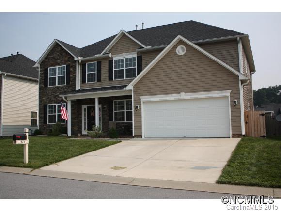 277 Roanoke Road Fletcher, NC 28732 - Photo 2 of 24 a front view of a house with a yard and garage