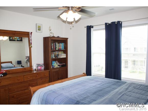 277 Roanoke Road Fletcher, NC 28732 - Photo 12 of 24 a bedroom with bed and window