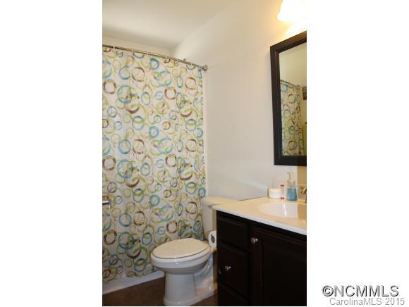 277 Roanoke Road Fletcher, NC 28732 - Photo 14 of 24 a bathroom with a sink vanity and mirror