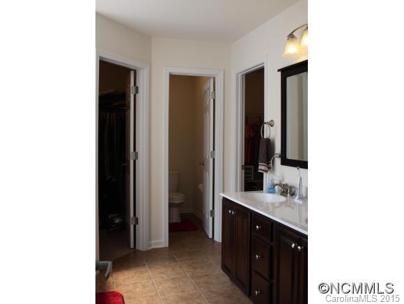 277 Roanoke Road Fletcher, NC 28732 - Photo 18 of 24 a bathroom with a double vanity sink and a mirror