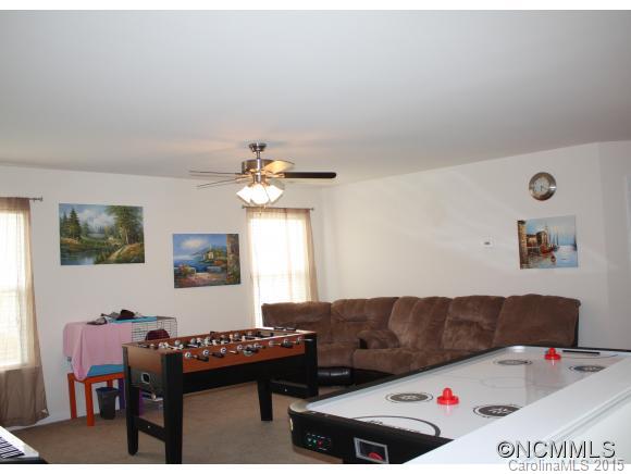 277 Roanoke Road Fletcher, NC 28732 - Photo 20 of 24 a living room with furniture and a table