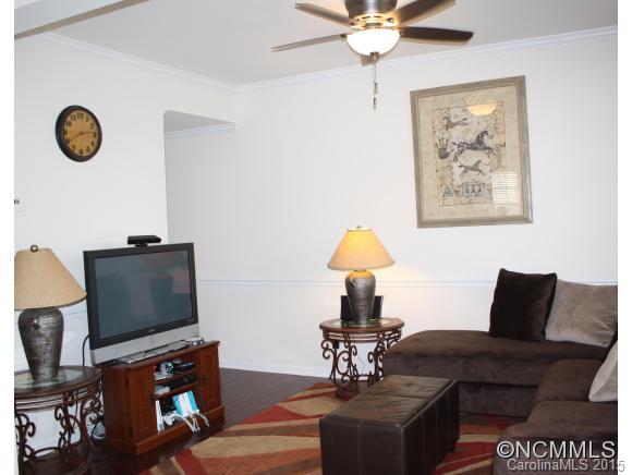277 Roanoke Road Fletcher, NC 28732 - Photo 4 of 24 a living room with furniture and a flat screen tv