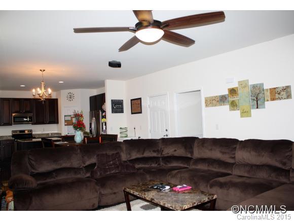 277 Roanoke Road Fletcher, NC 28732 - Photo 5 of 24 a living room with furniture and a flat screen tv