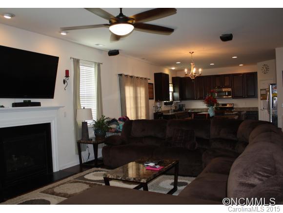 277 Roanoke Road Fletcher, NC 28732 - Photo 6 of 24 a living room with furniture and a flat screen tv