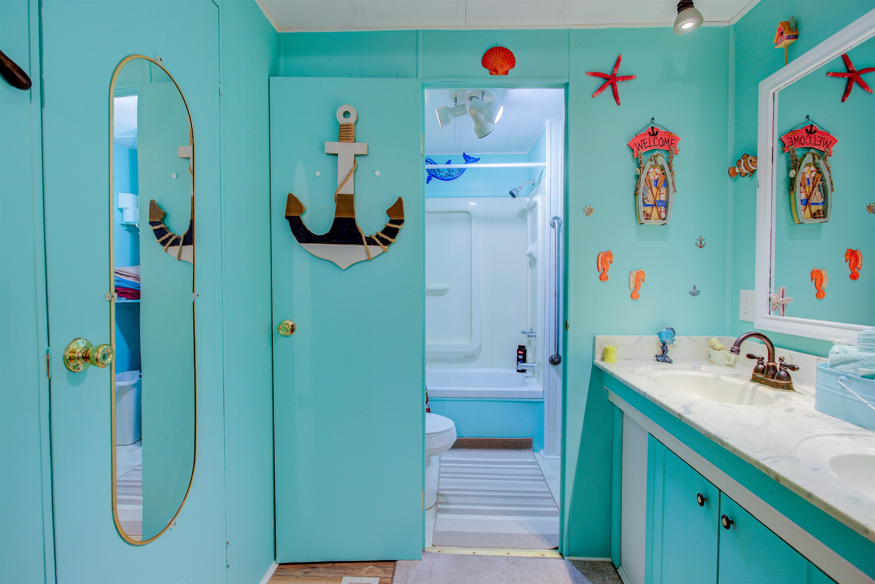 736 San Mateo Road Satsuma, FL 32189 - Photo 14 of 41 a bathroom with a sink and a mirror