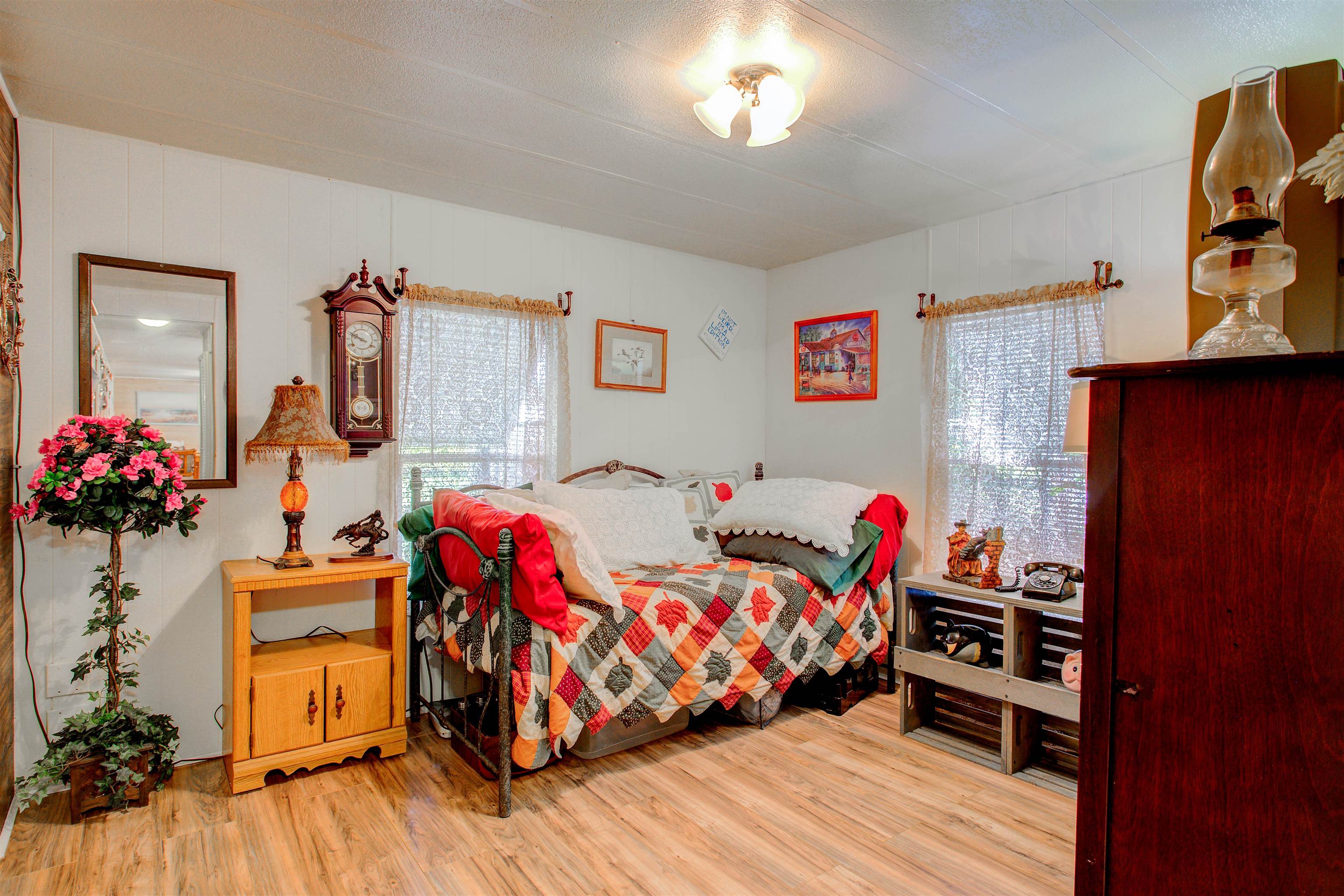 736 San Mateo Road Satsuma, FL 32189 - Photo 19 of 41 a bedroom with furniture and a wooden floor