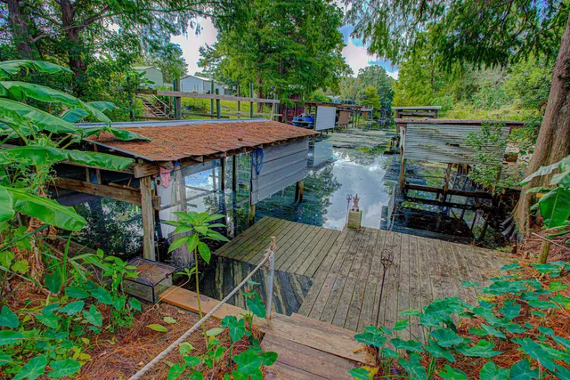 a small garden covered with wooden fence
