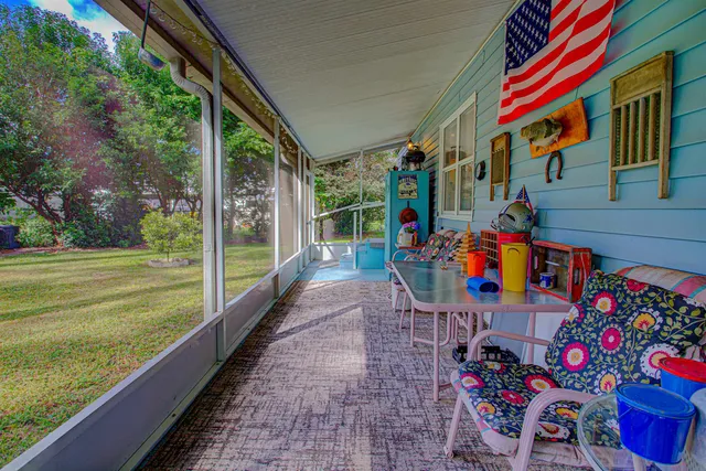 a view of a backyard with sitting area