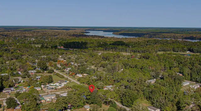 a view of a backyard with a tub and outdoor space