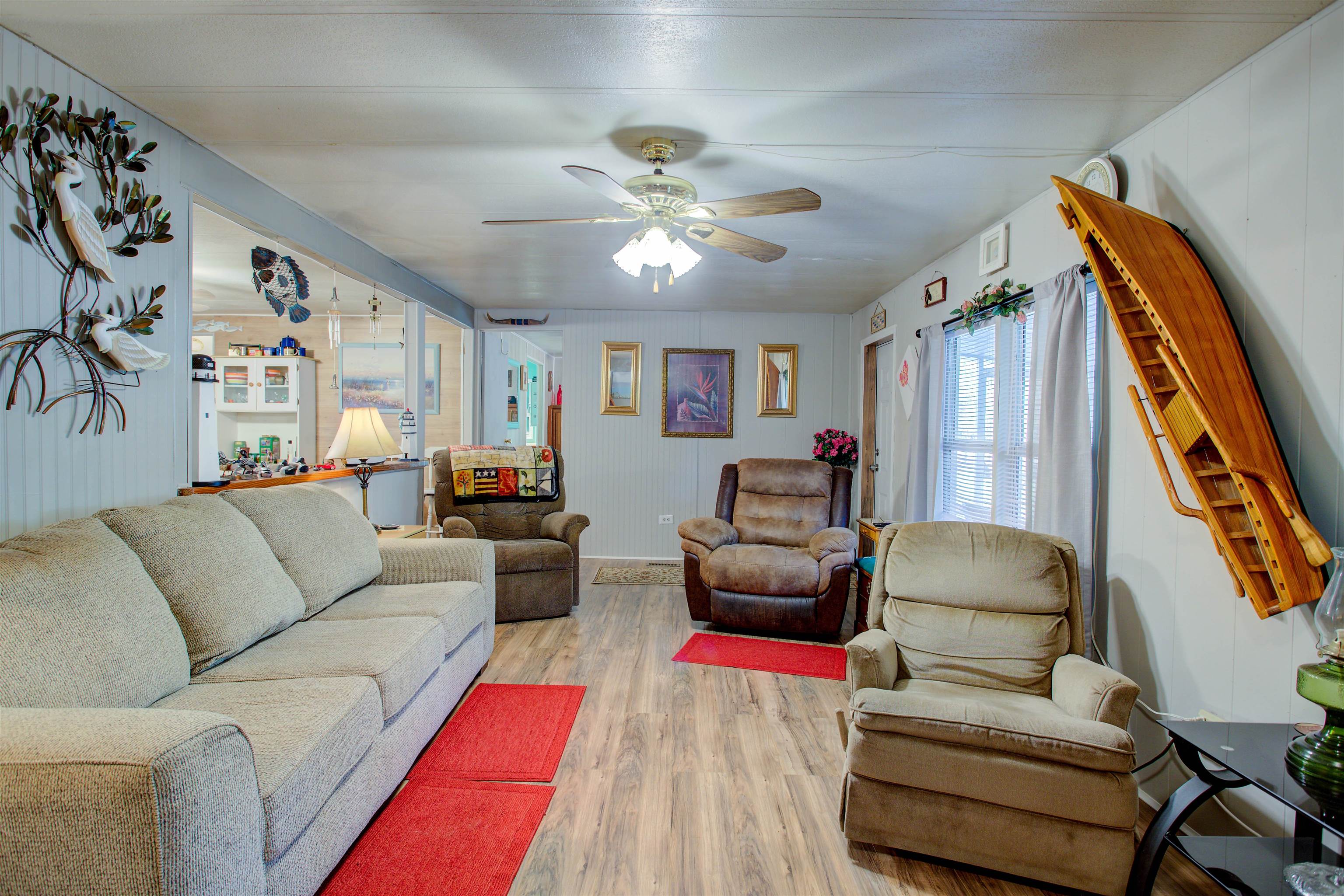 736 San Mateo Road Satsuma, FL 32189 - Photo 5 of 41 a living room with furniture and wooden floor